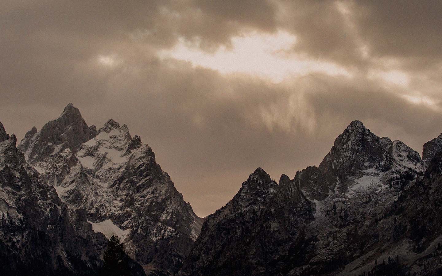 Dark clouds over mountain peaks