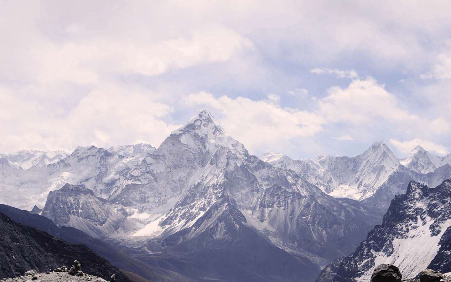 Snow covered mountains and cloudy sky